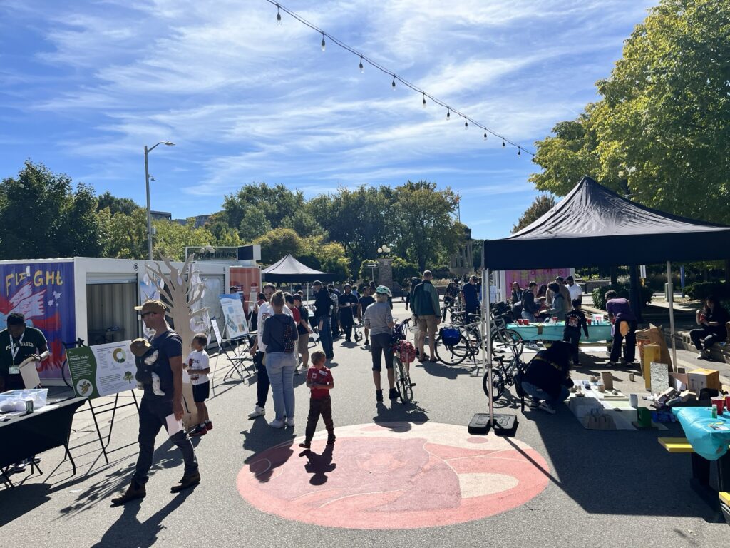 Several people walking through the Block Party engagement event